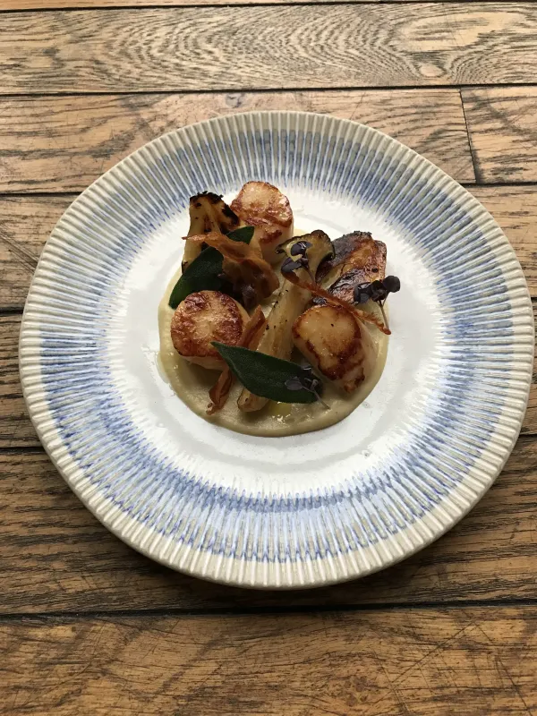 Elegantly plated dish with seasonal ingredients